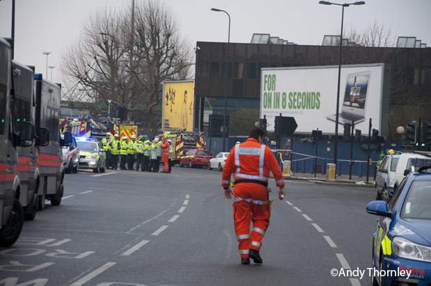 Heli-medics arrive by car on Wandsworth Road to treat casualties