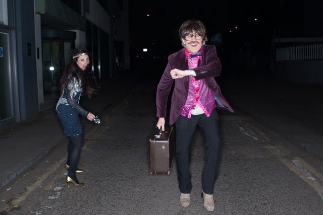A couple of performers make their way to the London Eye.