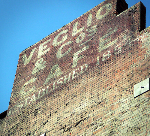 Veglio &amp; Co cafe. This sign above Tottenham Court Road station was revealed after being hidden for many years during the Crossrail works. Photo by buckaroo kid