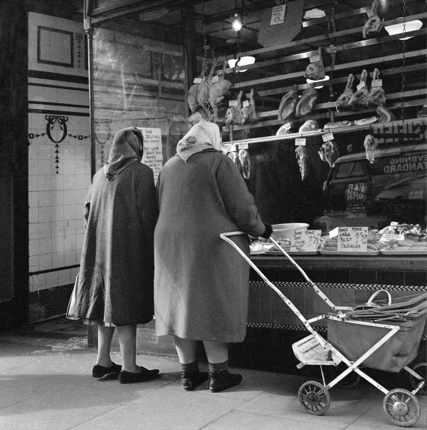 Women shopping in Wilson Bros butcher's shop, 1960s. Photo by Chris Arthur.