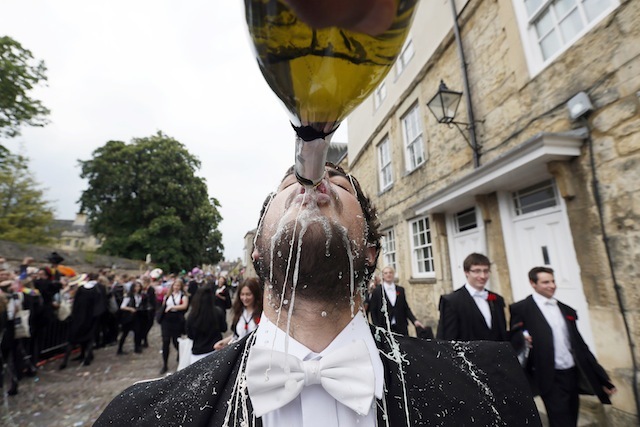 A student from University College Oxford gets "trashed" after finishing his exams in Oxford, southern England June 7, 2013. Trashing is the practice at Oxford University where students have all manner of messy items thrown at them by their contemporaries after finishing their exams. REUTERS/Stefan Wermuth  (BRITAIN - Tags: SOCIETY EDUCATION) - RTX10F3O