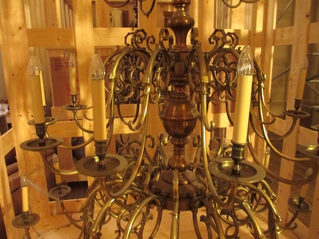 A chandelier waits in storage.