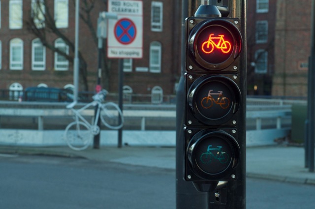 A ghost bike in the background offers a reminder as to why the improvements were nessecery