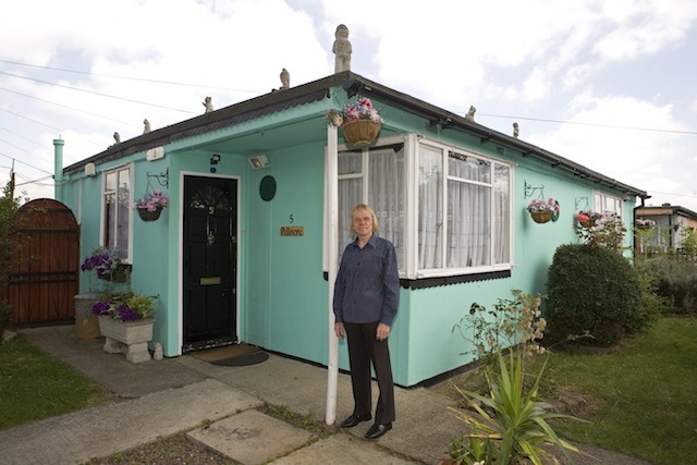 Jim in front of his prefab at the Excalibur estate in Catford, South London. He has been living in his prefab for 20 years and is fighting to save it as the Lewisham Council want to pull the prefabs down.