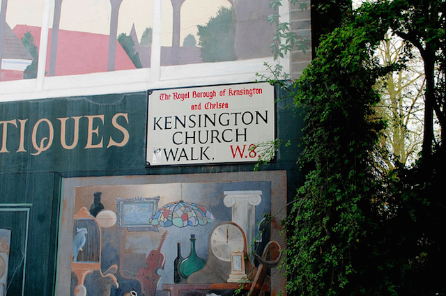A back walk of Kensington, the street sign shadowed by a mural. Image: HoosierSands