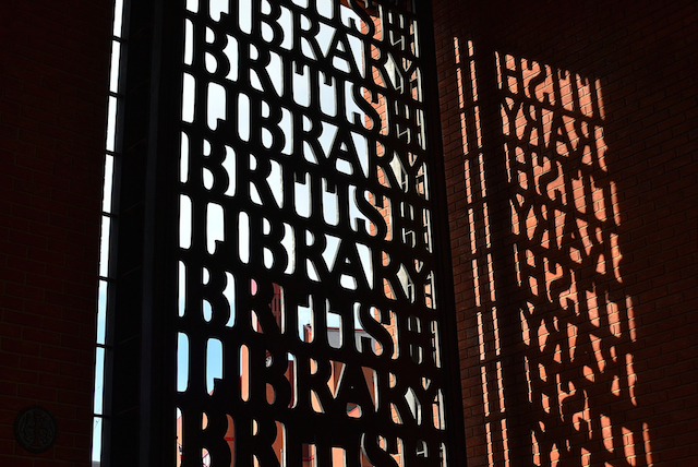 Gates of the British Library, and silhouette o opposite wall, by psyxjaw