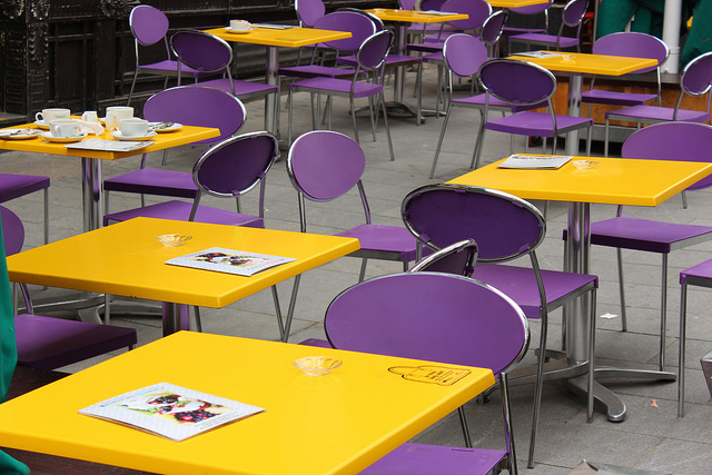 Café with yellow and purple furniture, by GediUK