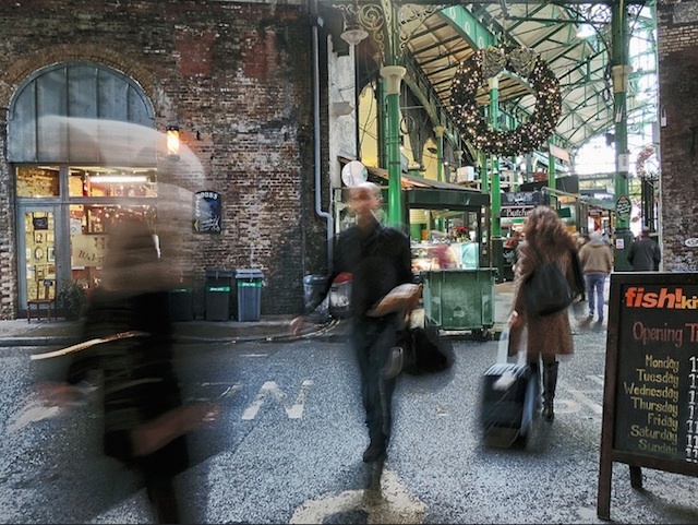 The hustle and bustle of Borough Market at Christmas time, photographed by Duncan Harris.