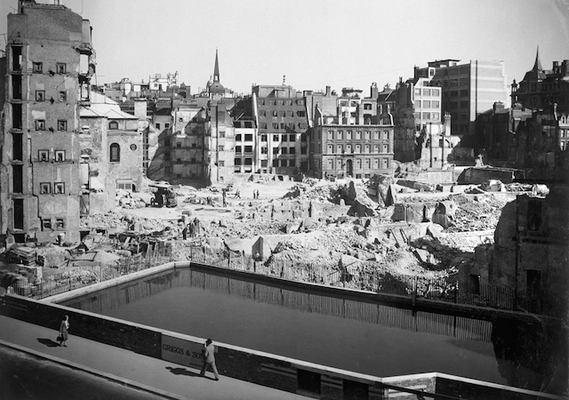 Emergency water supply at Queen Victoria Street. Looking across the emergency water supply in Queen Victoria street to Walbrook and Bond Court. To the left of the traction engine is St. Stephen's Church. Photograph by Arthur Cross / Fred Tibbs