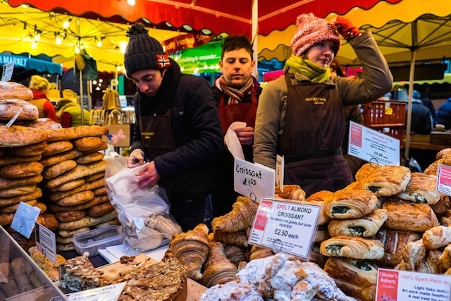 Of course, the market wouldn't be complete without the resilient traders, working through rain and shine. Photo by Stovin.