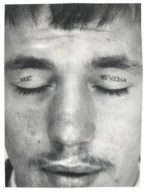 Police Files Print No. 7. Text reads 'Do not / Wake'. Eyelid tattoos are made by inserting a metal spoon under the eyelid so that the ‘needle’ doesn’t pierce the eye.
© Arkady Bronnikov / FUEL