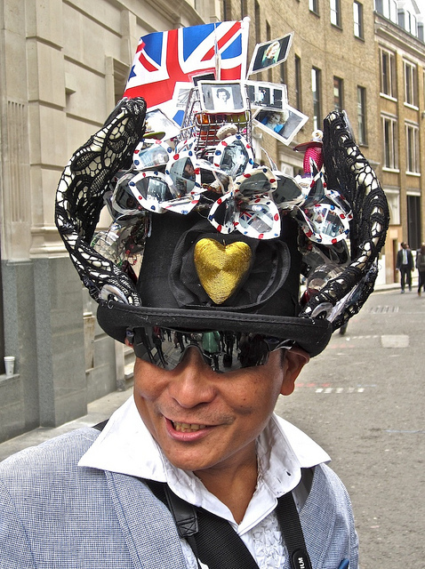 Man with Margaret Thatcher hat, by Andy Worthington 