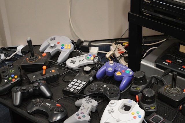 Discarded console controls from different eras.
