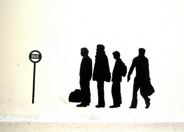 Stencilled street art of a bus stop queue. Photo: Annie