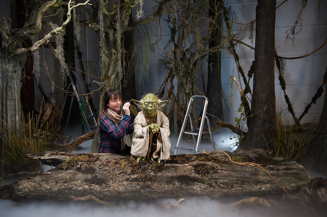 The finishing touches are put to a wax model of Yoda in preparation for the May opening of the new Star Wars experience.