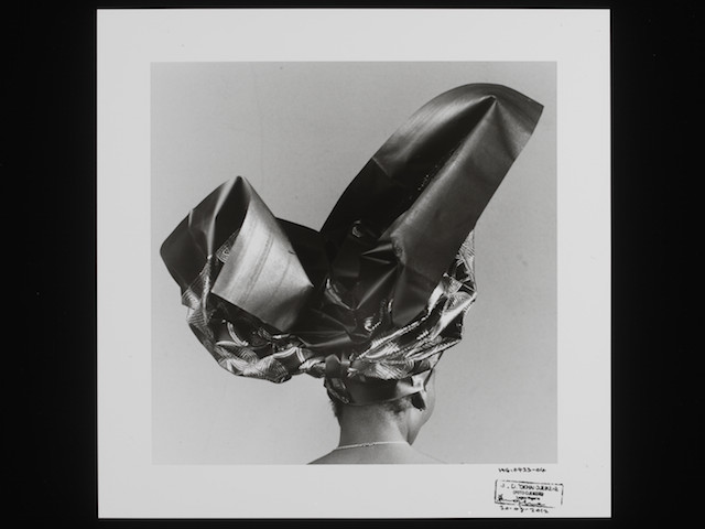 E.227-2013
Photograph
Untitled, HG 423-04, 2004; A black and white photograph of an African woman seen from the back wearing an elaborate headtie, by J. D. 'Okhai Ojeikere, from the series 'Headties.'
J.D. Okhai Ojeikere (1930-)
1970s