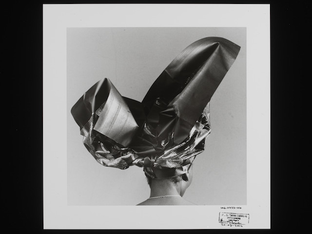 E.227-2013

Photograph
Untitled, HG 423-04, 2004; A black and white photograph of an African woman seen from the back wearing an elaborate headtie, by J. D. 'Okhai Ojeikere, from the series 'Headties.'
J.D. Okhai Ojeikere (1930-)
1970s