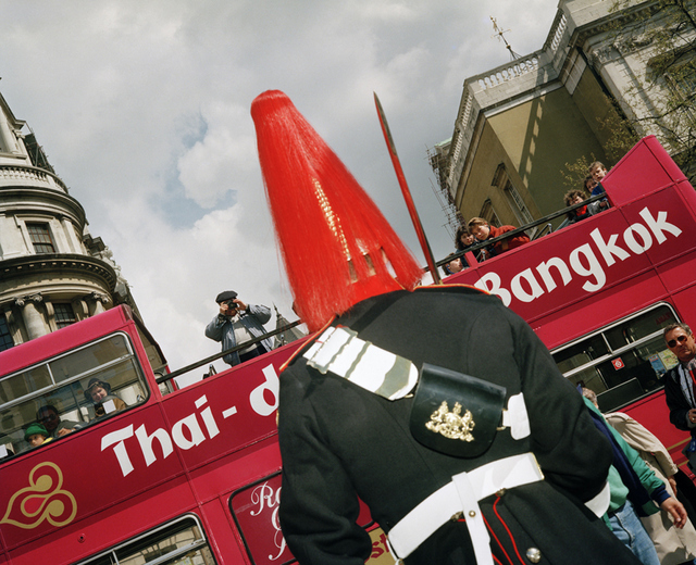 A more recent addition as a tourist snaps one of the soldiers on Horse Guards Parade, 1993. Photo: Paul Reas.