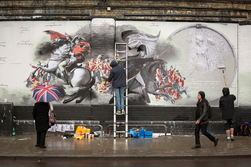 Passers-by in Shoreditch were treated today as the National Army Museum revealed a new piece of street art to mark the 200-year anniversary of the Battle of Waterloo on 18 June 2015.
 
Representing British soldiers over the last 200 years, the art stands as a memorial of all the brave men and women who have served Britain since the Battle of Waterloo in 1815.
 
To check out the Banksy-inspired street art, entitled 'The Returning Soldier'  just pop along to Shoreditch Art Wall and share your #WaterlooLives pictures. More information about the Battle of Waterloo can be found at: www.waterloo200.org