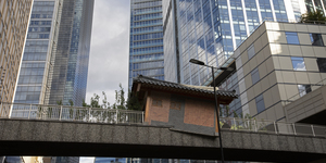 A Traditional Korean House Crash Lands On A City Footbridge