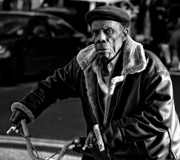 Man pushes bicycle, Portobello Road