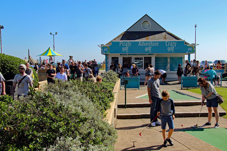 People playing mini golf