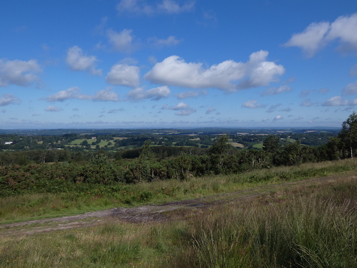 A view across countryside from the top of a hill