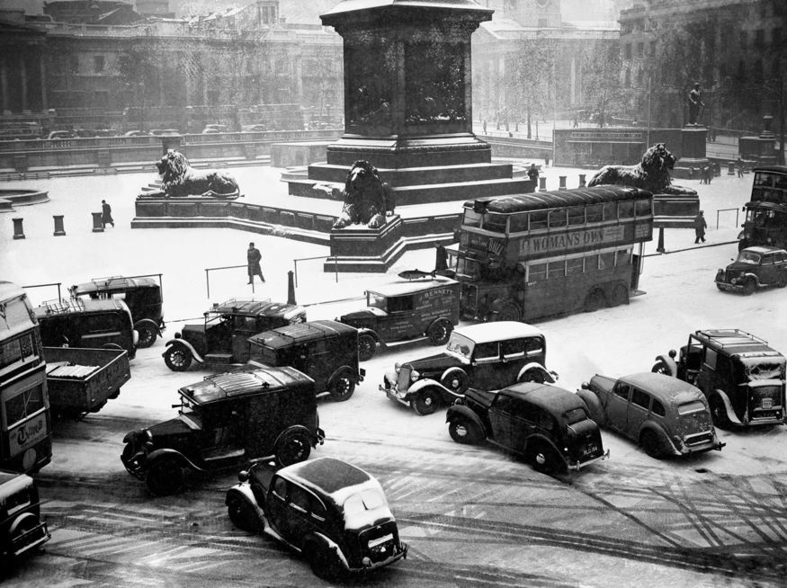 vintage cars in a snowy trafalgar square