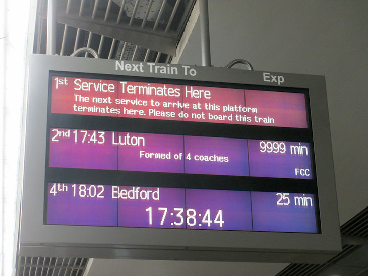 A train indicator board says the next train terminates here, while the next is 9999 minutes
