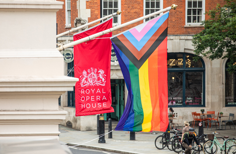 the entrance to roh - next to its own flag is one for the lgbtq/trans community