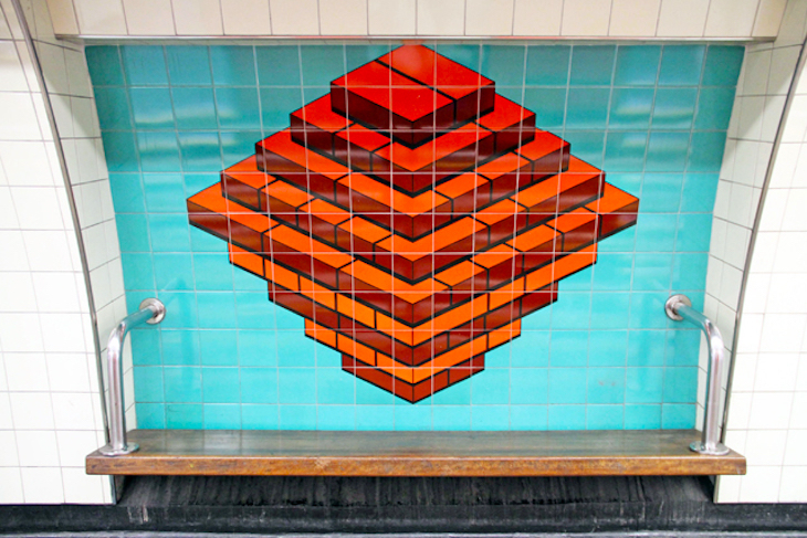 A pile of bricks printed onto tube station tiles to represent Brixton.