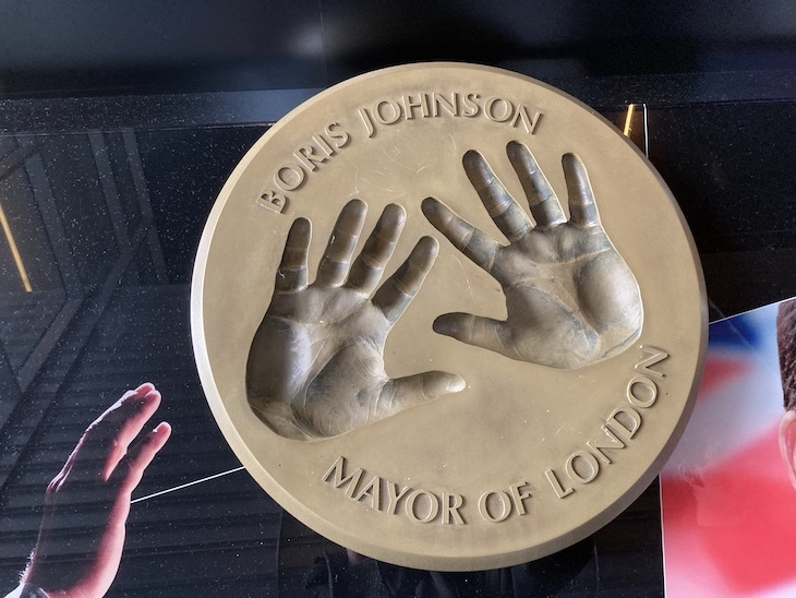 Two hand prints on a brass disc, with the legend Boris Johnson Mayor of London