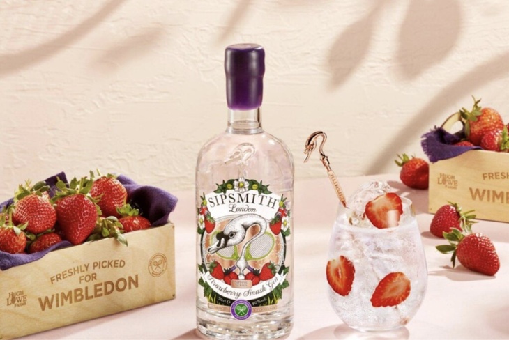 A bottle of Sipsmith Wimbledon gin surrounded by boxes of strawberries