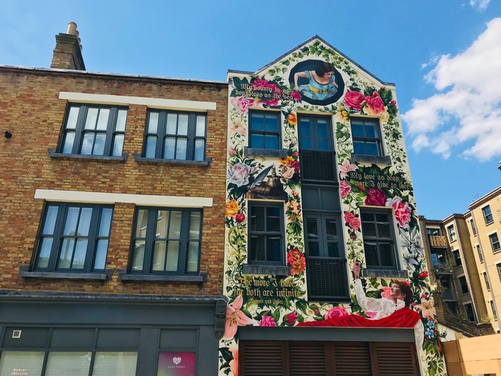 A beautifully floral mural featuring Romeo and Juliet