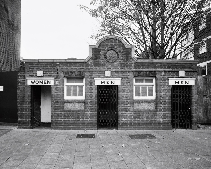 Victorian toilets with two doors marked 'men' and just one, 'women'