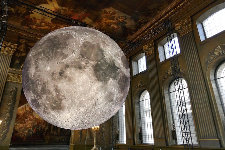 A huge moon sculpture hanging in the Painted Hall at Old Royal Naval College