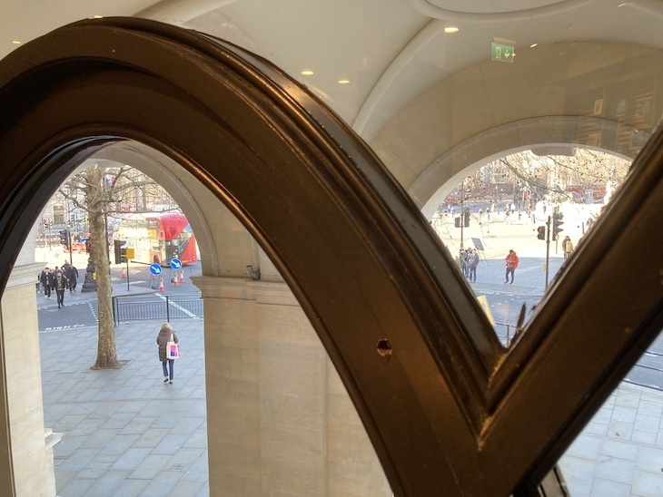 Looking out of an arched window towards Trafalgar Square