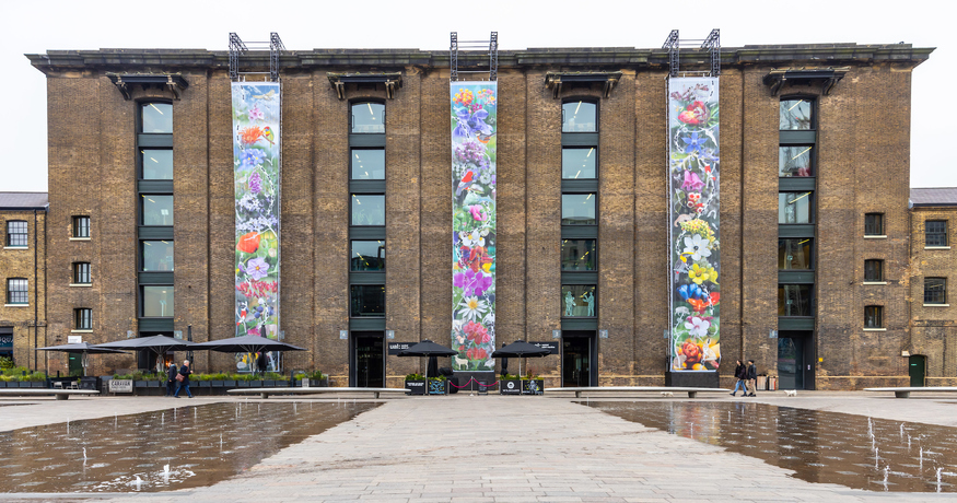 The Granary building sees three monumental, 60-foot prints featuring gigantic images of flora photographed by Lucy + Jorge Orta.