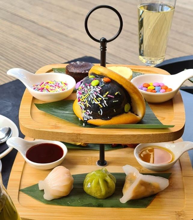 The dim sum afternoon tea on a two-tiered wooden stand