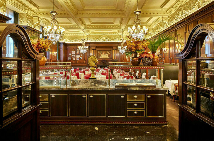 Wide shot of a glitzy restaurant with chandeliers