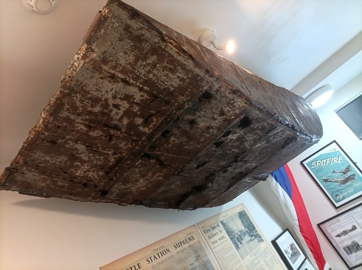 A huge wedge of metal hanging from the ceiling