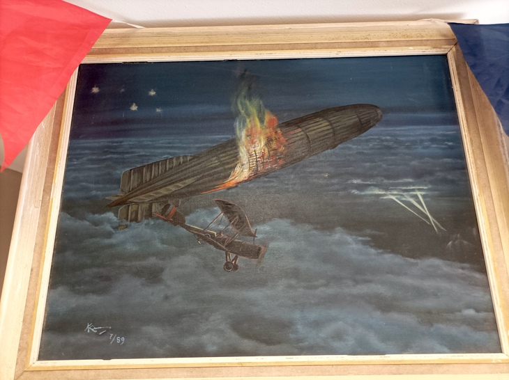 A painting of a Zeppelin being shot down