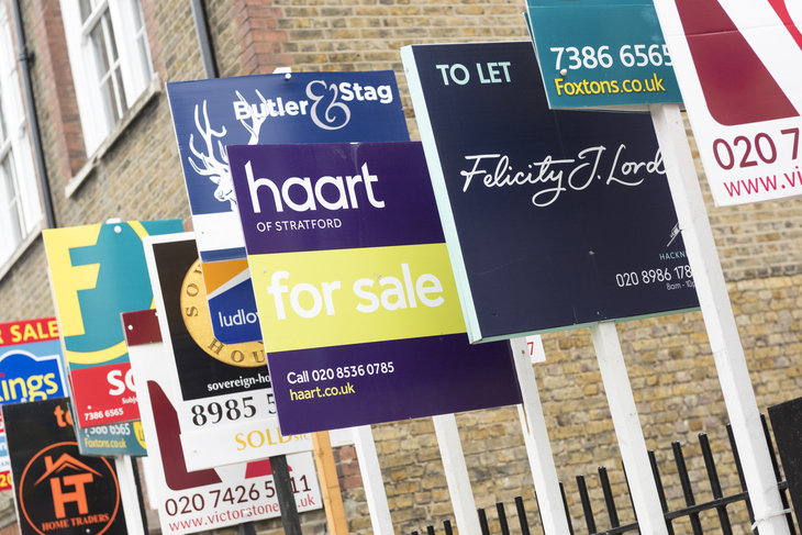 A line of for sale signs