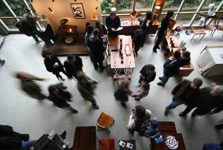 People wandering among stalls at the Midcentury Modern, photographed from above.
