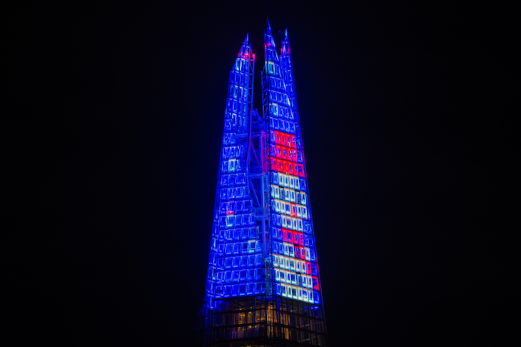 A glowing Shard top with snowman