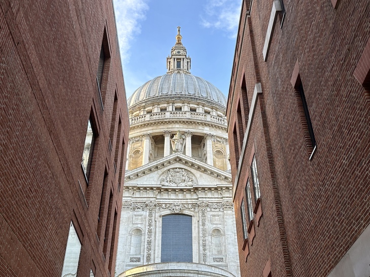 St Paul's as flanked by two modern brick walls