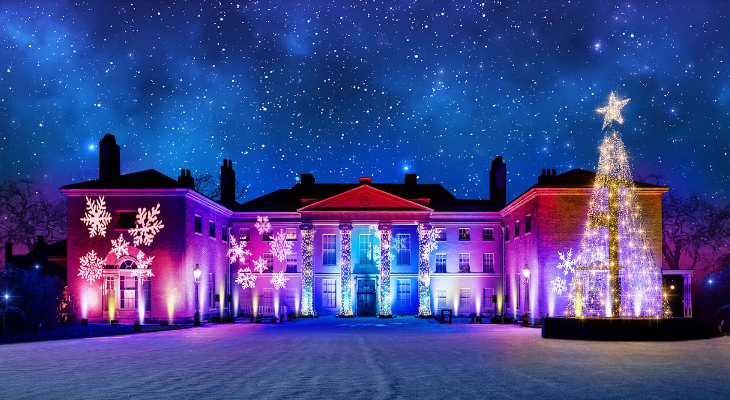 A CGI of Kenwood House illuminated in different colours, with a Christmas tree on the right, and snow falling.