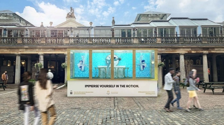 Swimmers in a tank in Covent Garden