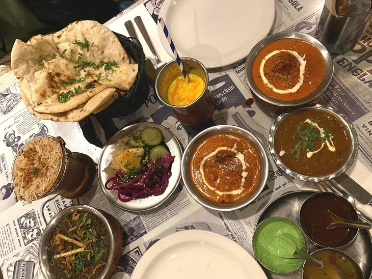 A delicious looking spread of curries and lassi