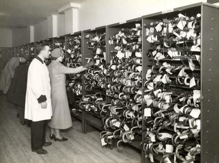 A woman sifts through hundreds of umbrellas